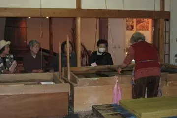 Women watching worker
