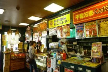 A customer ordering before taking a seat. The bilingual menus make it easy!