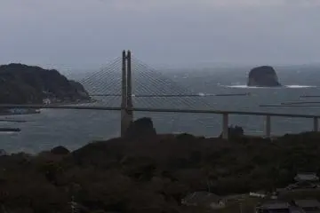 <p>Stormy view of the big bridge to Kabe Island, with Taka Island on the right</p>