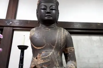 <p>Wooden statue of Dainichi-Nyorai (Vairocana) made during the late Heian Period (794 - 1185) in the entrance hall of the temple</p>