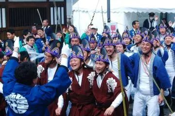 <p>These men wearing a "tori" or "chicken" inspired head piece are very enthusiastic, chanting Yoyasa!&nbsp;</p>