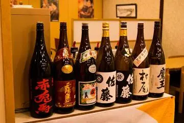 <p>Bottles stacked in the traditional bar</p>