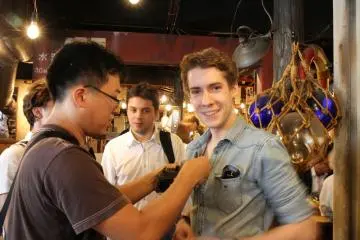 <p>We were invited for a food tasting session for a TV show. Now the TV crew is installing the mics.</p>