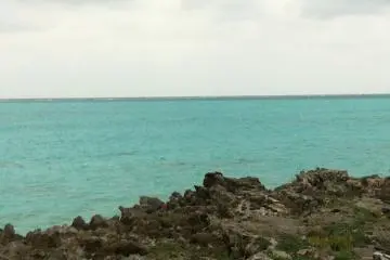 Cloudy skies but the sea is still somehow glowing