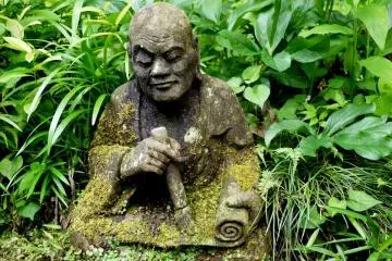 <p>Statue of monk writing on a scroll. I love the expression on his face!</p>