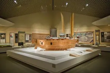 The two 16th century ships, with the Japanese one in the foreground; the Korean Turtle Ship's sails are seen behind it