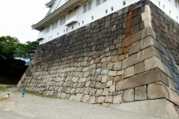 <p>The stone base of the main tower looks distorted. It is said that the castle was bombed severely during WWII and the stone base was damaged...</p>