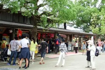 <p>Many shops are lined up and selling souvenirs or food to visitors</p>