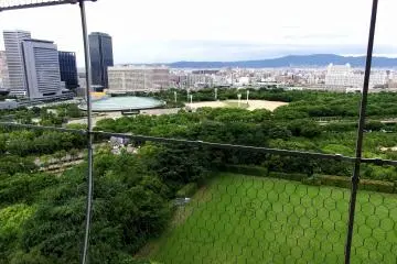 <p>The view from the top of the main tower. The round-shaped architecture on the upper left is the Osaka Castle Hall</p>