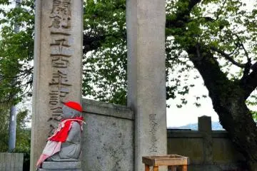 Gate posts and Buddha statue