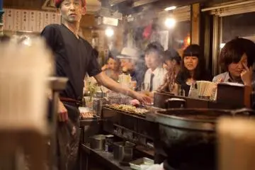 <p>Another chef attending to grill</p>