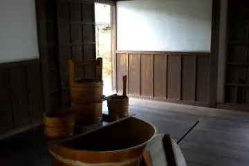 <p>Guests would wash off the dust and grime of travel in this wooden tub</p>