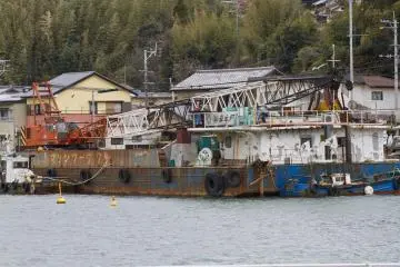 <p>A few industrial ships also line the harbor</p>