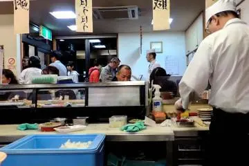 <p>People in the waiting area just really shows that they have the best sushi.</p>