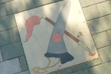 Street paver showing Kato kiyomasa's helmet and baton.