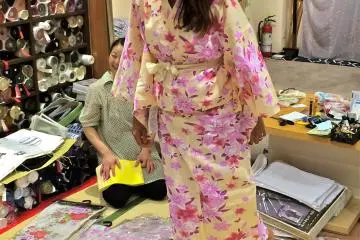Trying on a pair of&nbsp;Geta, traditional wooden sandals, that were pre-packaged with the Yukata set at Nunoya.