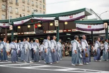 <p>Walking in their traditional outfits.</p>