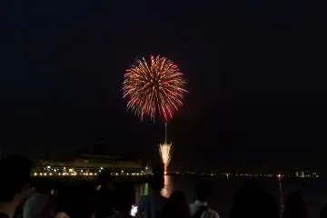 Several people standing transfixed at the spectacle above them