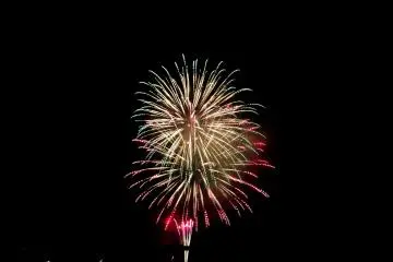 Nearing the finish! Several rainbow colored fireworks launch one of their last assaults of the evening