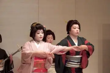 <p>Awara Geigi, Ms. Hisano (left) and Ms. Otome (right), dancing 'Karakasa (paper umbrella)</p>