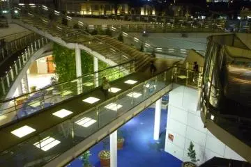 Below the large dish is a network of walkways and bridges leading to the various shopping areas and bus terminal.