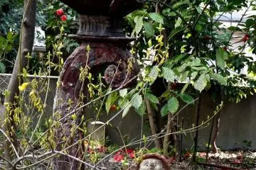 <p>I love this strange metal lantern with the small statues beneath</p>