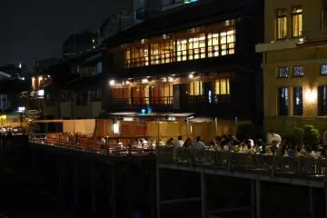 <p>In summer restaurants beside the river erect raised wooden decks for their customers to enjoy riverside dining</p>