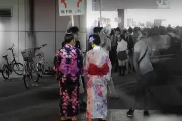 <p>Finding their way home! A couple of spectators deciding the best way to go home in front of a very crowded Sakuragicho Station.</p>