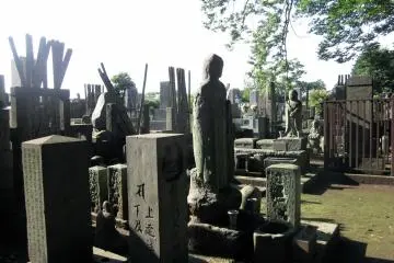 <p>Gotoku-ji has a cemetery filled with statues of various gods. Commonly you will see Japanese residents paying a visit to loved ones, making it a quiet and peaceful scenery.</p>