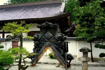 <p>A massive kawara tile such as would crown a temple gable stands on display</p>