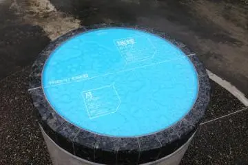 <p>One of the circular slabs representing the planets. This one is the Earth.</p>