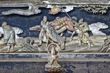 <p>A zoomed-out shot of the same Buddha showing the beautifully carved illustration in the background. Although not as famous as the temple complex of Nikko in Tochigi prefecture, the quality of these carvings is in no way inferior. In 1983 Ryuonji was officially designated a site of cultural importance by the Saitama Prefectural Government</p>