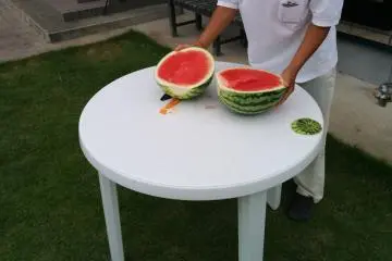 <p>Okui-san prepares the watermelon</p>
