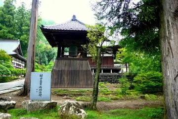 <p>The bell tower with two of the temple buildings in the background</p>