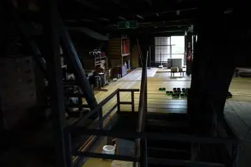 <p>The second floor acted as storage for silk production equipment, old furniture, trays of dishes, and many other interesting things</p>