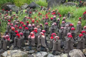 <p>On the way up to Sesshou Seki, the path is lined with small statues. These statues were placed here to represent lost babies</p>
