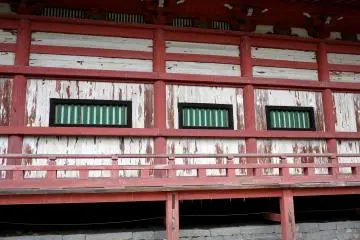 <p>The paint on the temple was worn and flaking</p>