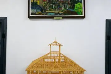 <p>A model of the wooden framework of the building stands below an impressionist painting &nbsp;</p>