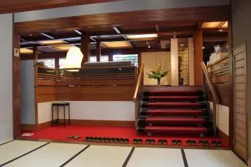 Slippers line the threshold to the entry hall