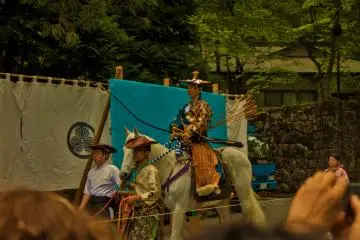 An archer marches into the contest area