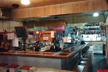 <p>Rear view of the large bar and kitchen area</p>