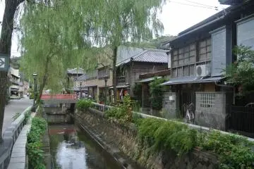 <p>Perry Road, with many old-style houses and shops on both sides of the river</p>