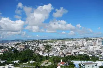 <p>A view atop the peace tower of the northern side of the island. Notice the US Military airfield, Futenma Air Station in the back ground</p>