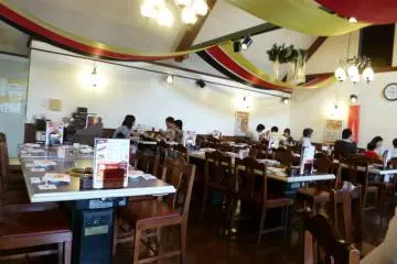 <p>Each table is equipped with it's own area to cook your own meat. There is a summer patio set up on sunny days in summer, but the interior ensures that you'll never get rained on!</p>