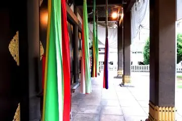 <p>Colorful strips hanging from the eaves</p>