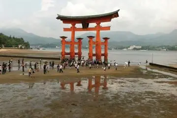 <p>Miyajima's&nbsp;famous torii is visible behind the stage</p>