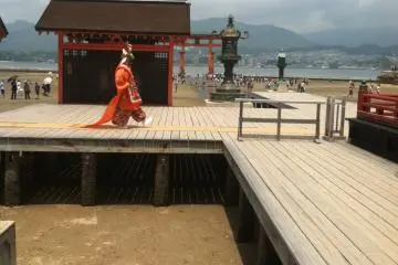 <p>The actor takes practiced steps to the main stage</p>