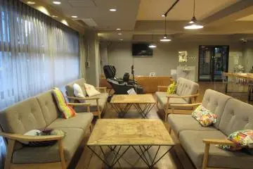 The lounge is next to the kitchen and has a massage chair