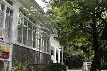 <p>From the gate, climb the stairs into the courtyard to reach the front entrance</p>