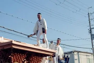 The daikugata (carpenter) stands bravely atop each float